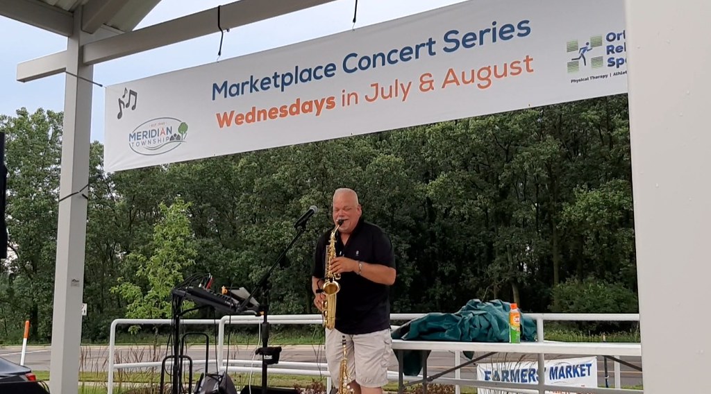 Rain, Summer Breeze and Steve Spees at Meridian Township’s Farmers’ Market